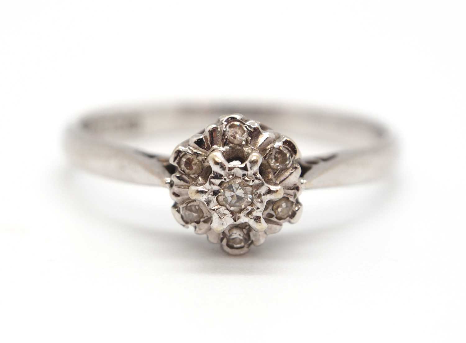 An 18ct white gold cluster ring, comprised of illusion mounted single cut diamonds, with plain - Image 2 of 7