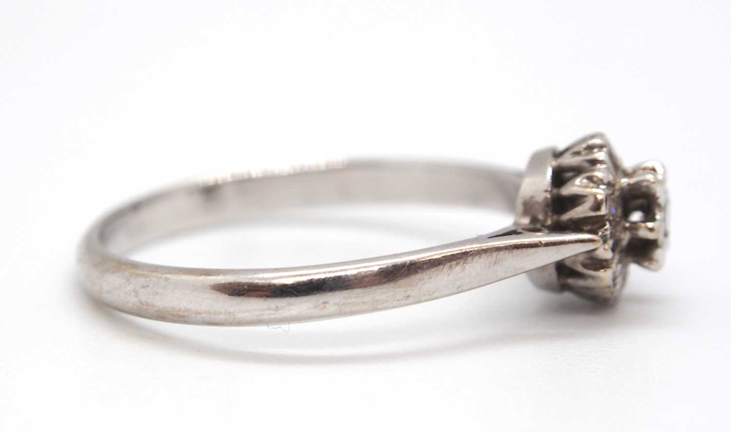 An 18ct white gold cluster ring, comprised of illusion mounted single cut diamonds, with plain - Image 3 of 7