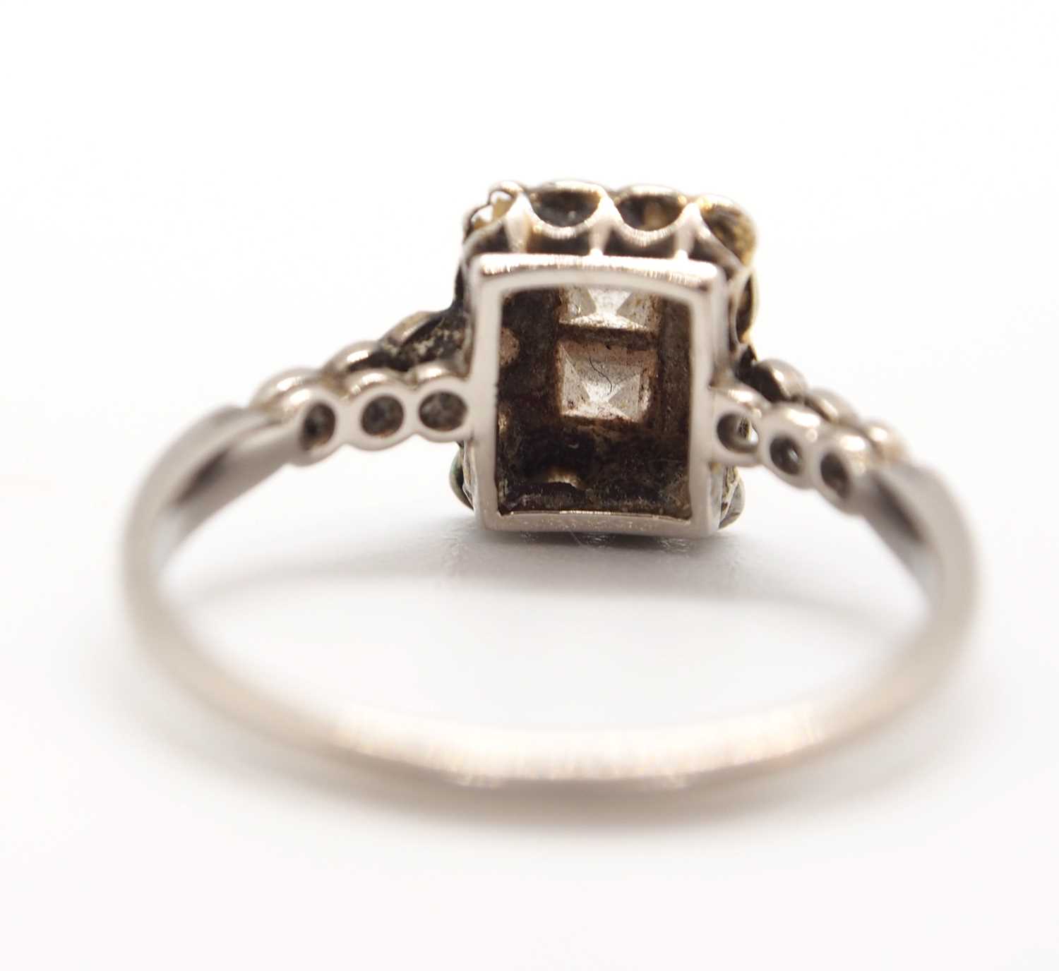 An Art Deco 18ct and platinum diamond ring, set to centre with two square step cut diamonds and - Image 3 of 9