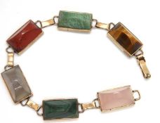 A gemset bracelet, the rectangular sugar loaf style cabochon gemstones, to include tigers eye,