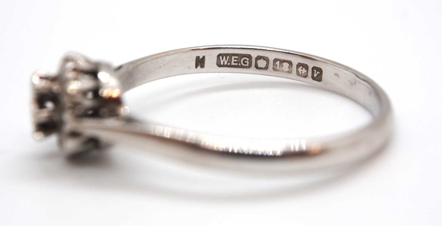 An 18ct white gold cluster ring, comprised of illusion mounted single cut diamonds, with plain - Image 5 of 7