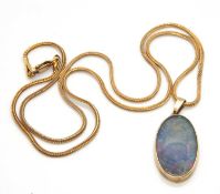 An opal pendant and chain, the oval opal in collet mount with open back, 25mm long, with tapered