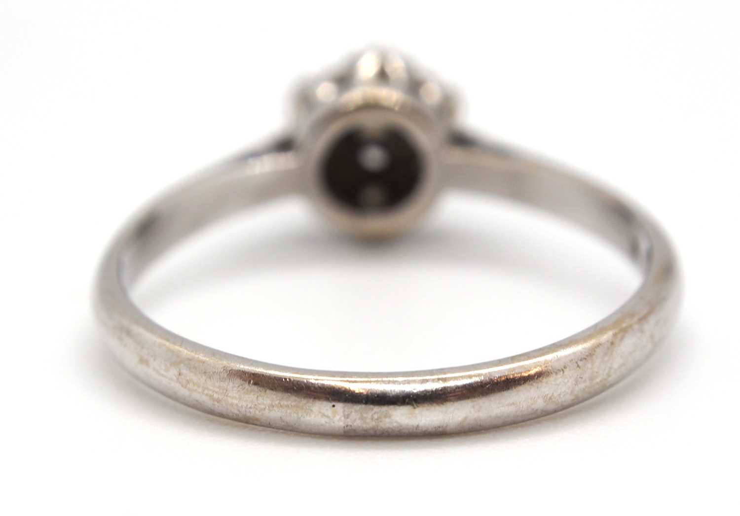 An 18ct white gold cluster ring, comprised of illusion mounted single cut diamonds, with plain - Image 6 of 7