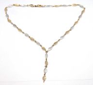 A 9ct bi-colour necklace, with alternating white and yellow gold leaf shaped links, stamped 375 to