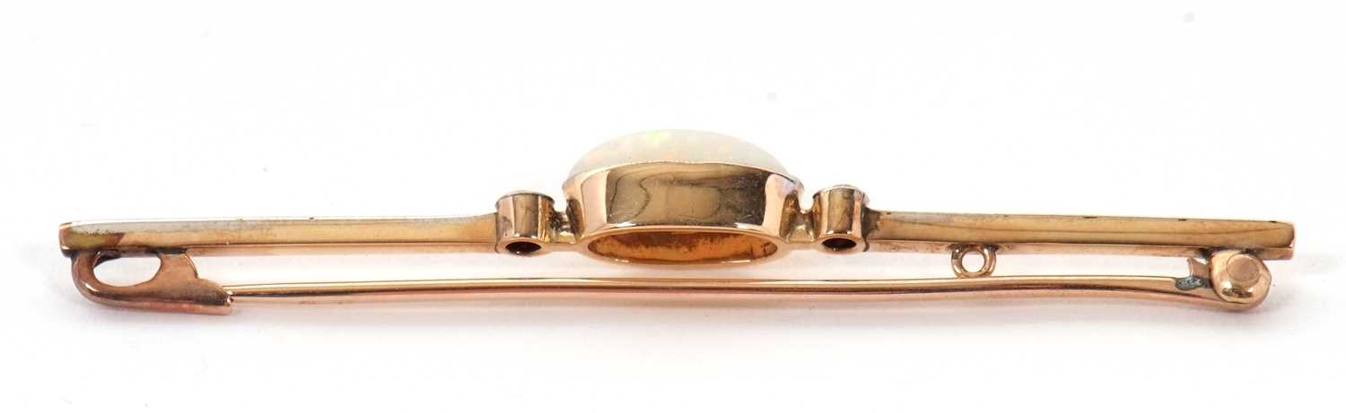 An opal and diamond bar brooch, the central oval marquise shape opal cabochon, approx. 11mm long x - Image 4 of 5