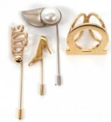 Four Salvatore Ferragamo scarf pins, (4)