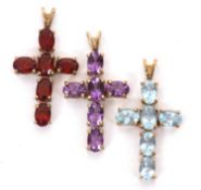 Three 9ct gemset cross pendants, to include an amethyst, a garnet and a topaz set cross, each set in