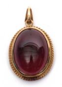 A garnet pendant, the oval garnet cabochon in collet mount with rope twist border and tapered