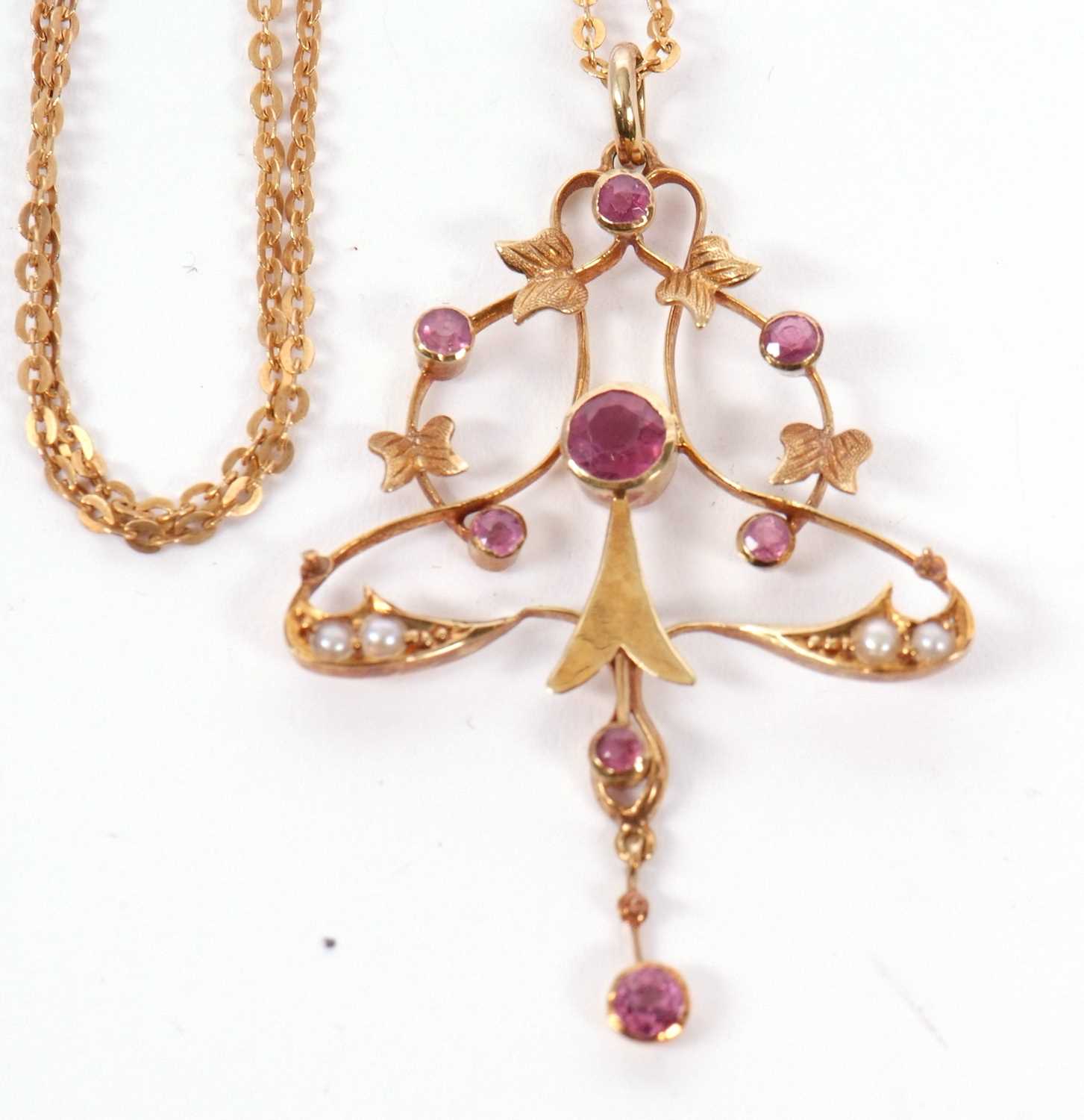 A 15ct pink tourmaline and seed pearl pendant and 9ct chain, set to centre with a round pink - Image 3 of 3