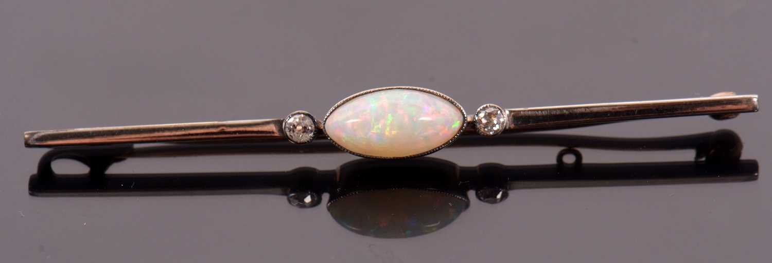 An opal and diamond bar brooch, the central oval marquise shape opal cabochon, approx. 11mm long x