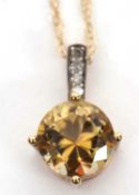 A 9ct diamond and yellow-brown treated quartz necklace, the round yellow-brown treated quartz, 8mm