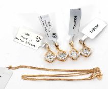 Four silver gilt aquamarine and diamond highlight pendants and one chain: the pear shape frame set