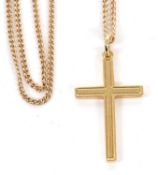 An 18ct cross and 9ct chain, the cross with textured design to one side and plain the other, stamped