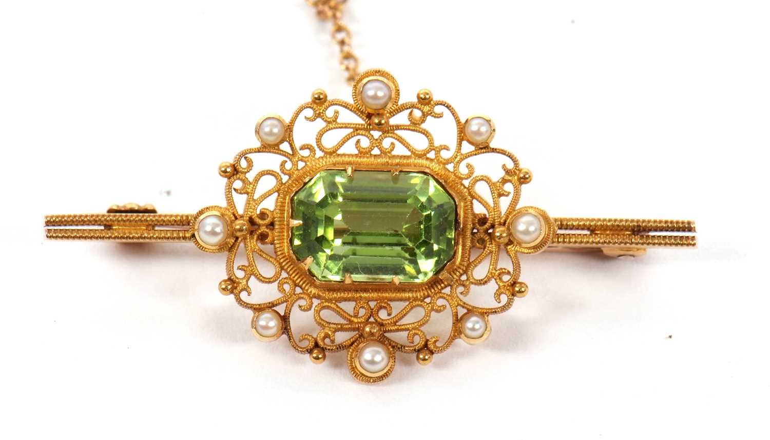 A 15ct peridot and seed pearl brooch, the rectangular mixed cut peridot in a collet and claw - Image 2 of 4