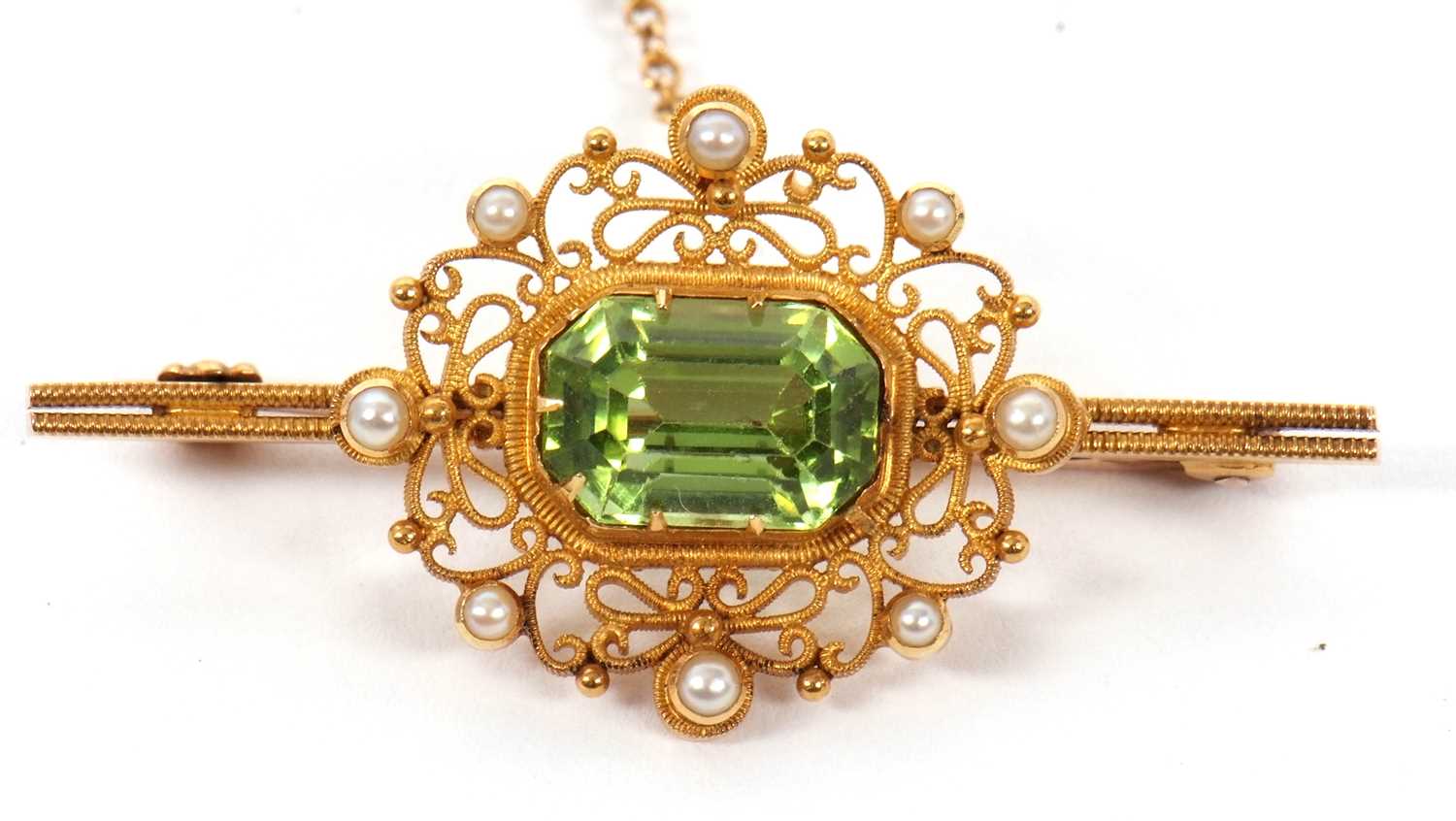 A 15ct peridot and seed pearl brooch, the rectangular mixed cut peridot in a collet and claw - Image 3 of 4