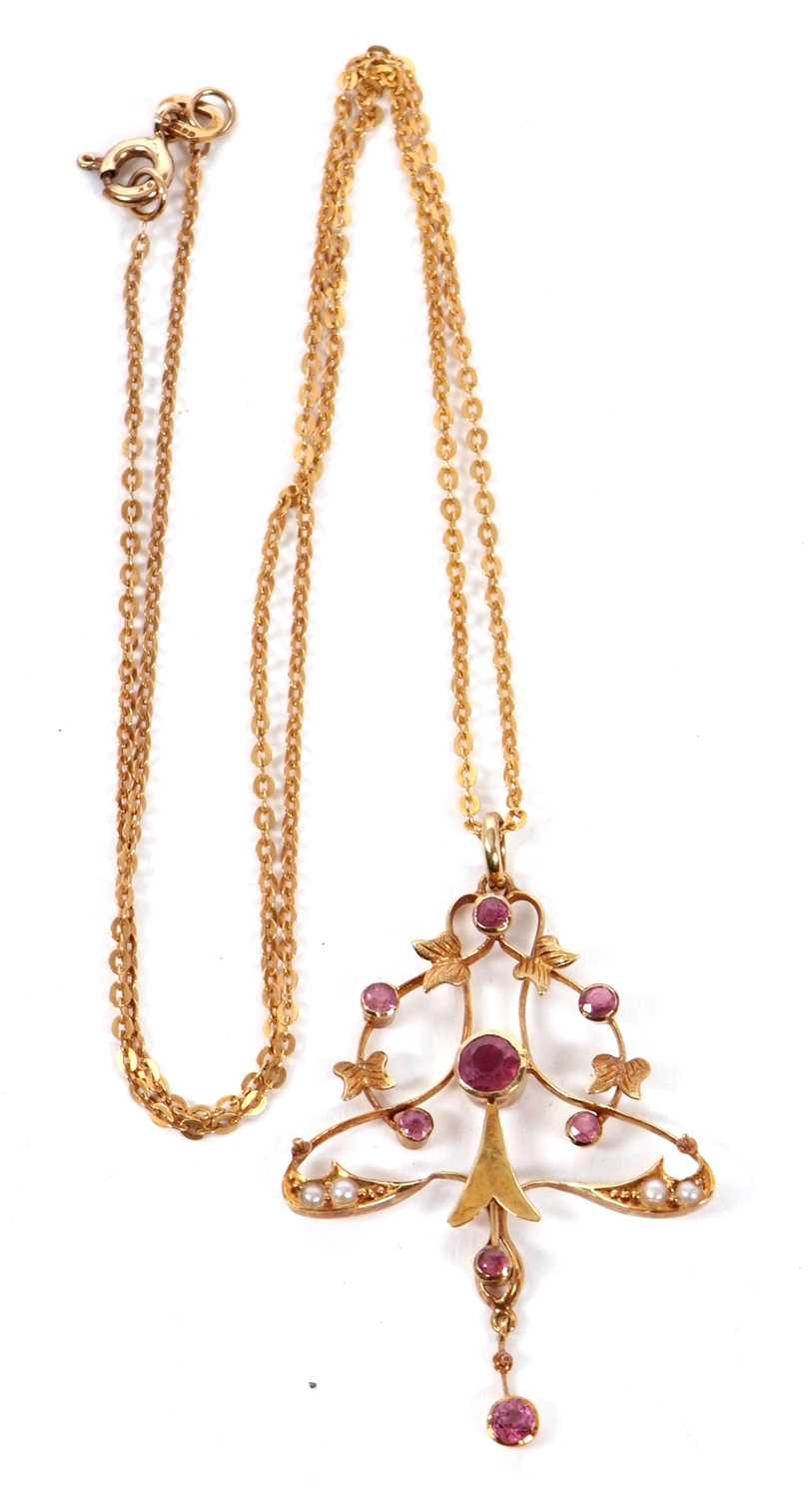 A 15ct pink tourmaline and seed pearl pendant and 9ct chain, set to centre with a round pink