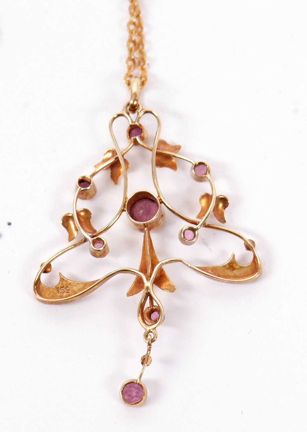 A 15ct pink tourmaline and seed pearl pendant and 9ct chain, set to centre with a round pink - Image 2 of 3