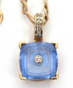 A 9ct topaz and diamond pendant necklace, the square topaz with a single diamond highlight to centre