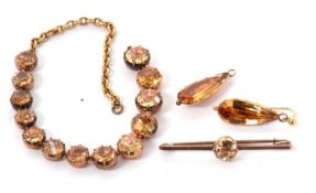 A part suite of Georgian foil backed topaz jewellery, to include a pair of pear shape drop earrings,
