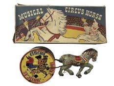 A boxed litho printed tinplate Musical Circus Horse by Louis Marx
