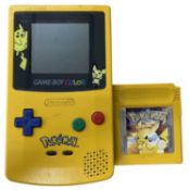 A Pokemon edition Gameboy Colour, together with a Pokemon Yellow game cartridge.