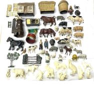 A collection of various die-cast farm buildings and animals, together with a small collection of