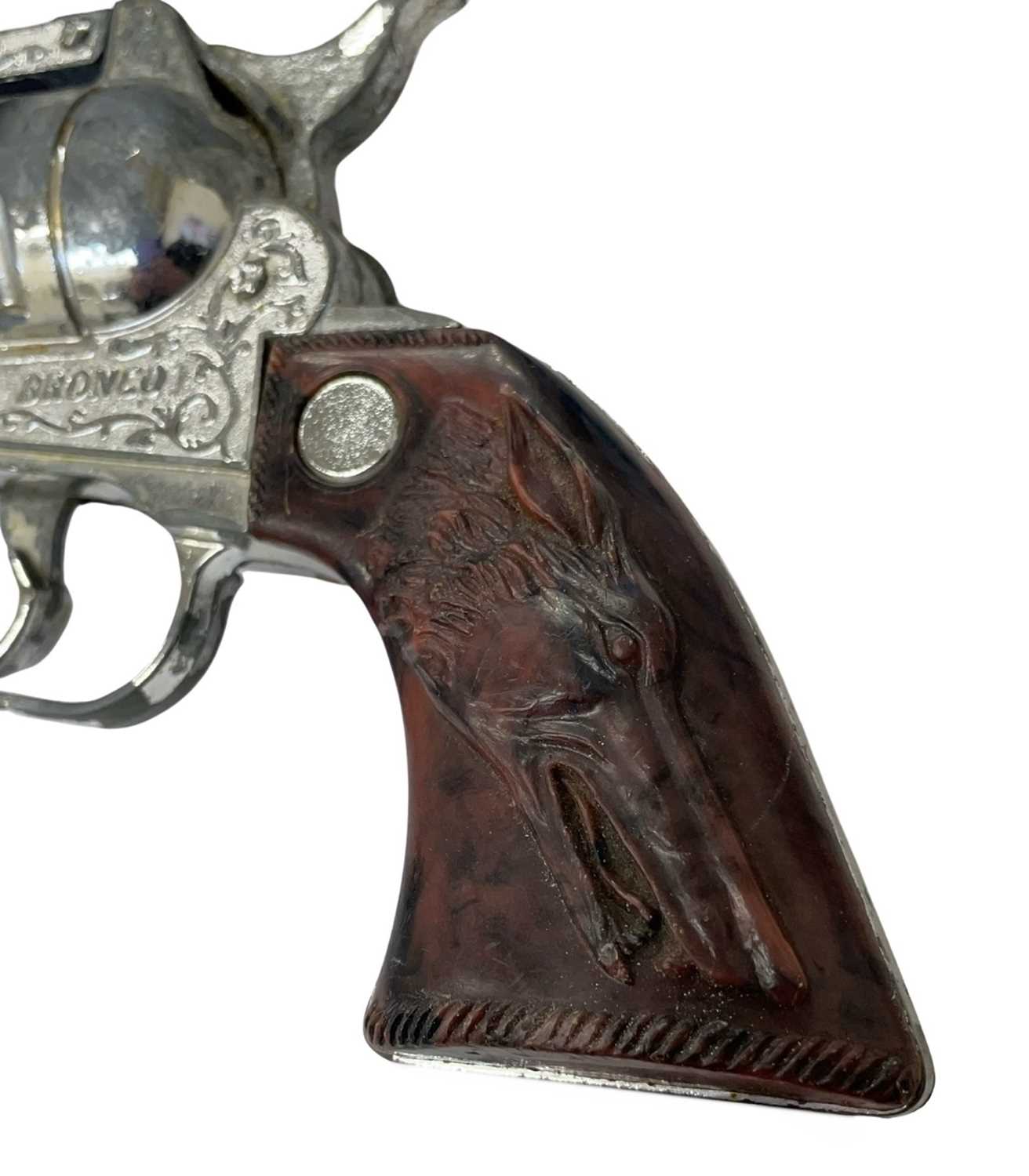 A vintage 'Rustler Bronco' toy revolver by Crescent Toys - Image 2 of 2