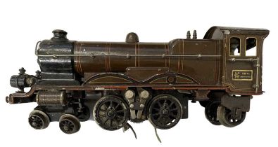 An early 20th century Marklin 0 gauge 4-4-2 locomotive in brown livery. Some wear to paintwork and