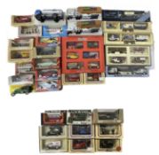 A mixed lot of various boxed die-cast vehicles.