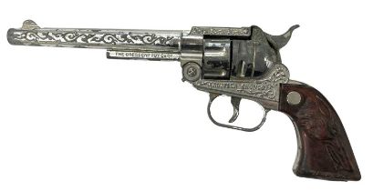 A vintage 'Rustler Bronco' toy revolver by Crescent Toys