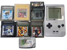 A Nintendo Pocket Game Boy, together with a quantity of games, and rechargable battery dock.