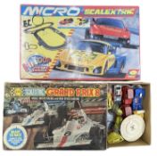 A boxed Micro Scalextric set, together with a boxed Grand Prix 8 set and assorted extra vehicles.