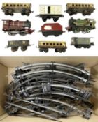 A collection of Hornby 0 gauge tinplate rolling stock and track.