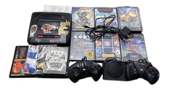 A Sega Mega Drive console, with 2 controllers and a quantity of game cartridges (please note: no
