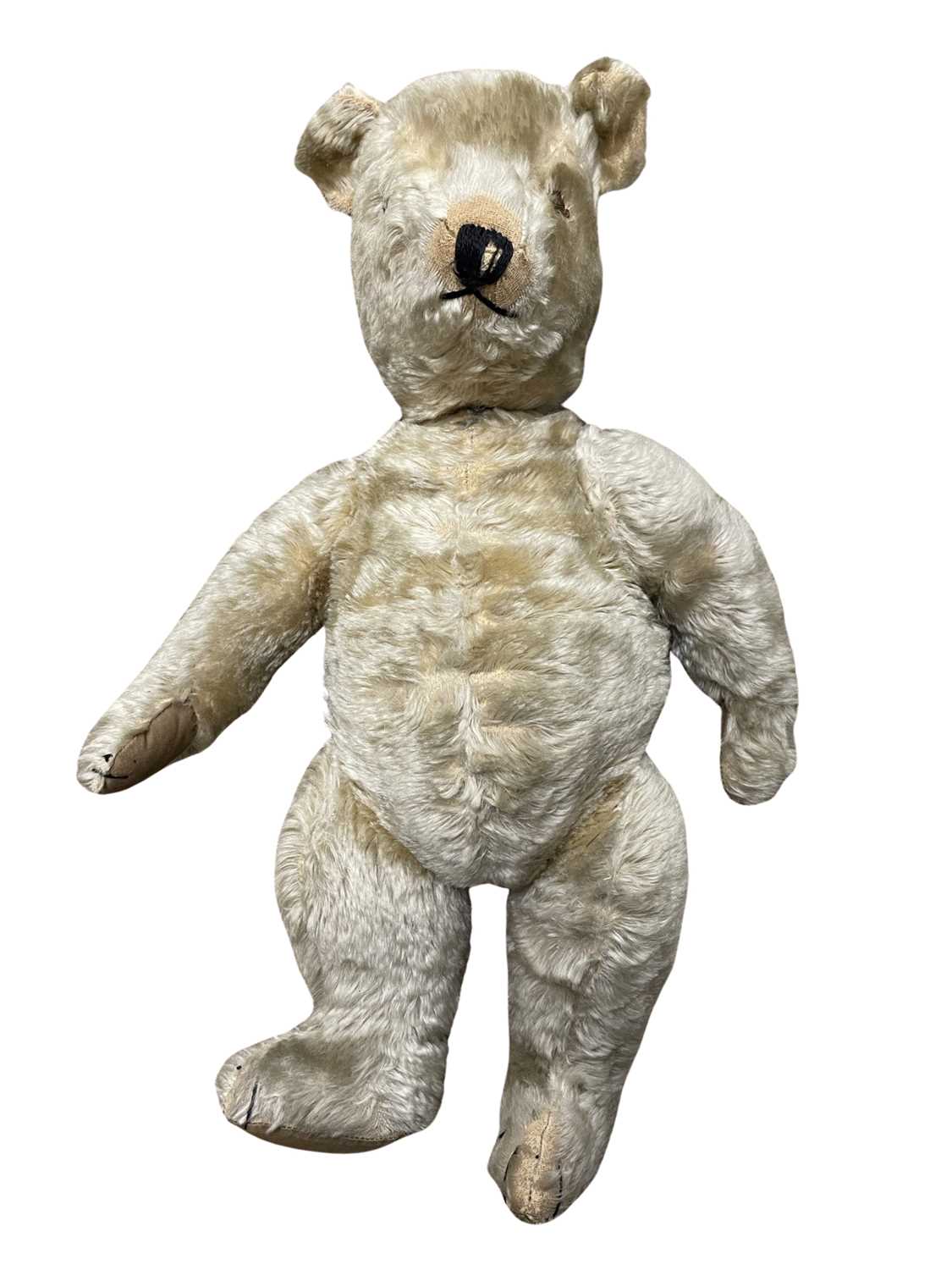 A large vintage 5-jointed teddy bear, with hand-sewn eyes, snout and paw detail. No maker's mark,
