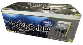 A boxed Rockband band kit for Xbox, to include Drums, 2 x guitars and microphone (Beatles game not