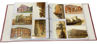 An album containing over 250 photographs of Norwich in the 1980s, with key, together with a