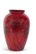 A large Moorcroft vase of baluster form, early 20th Century, decorated with cornflower with a flambe