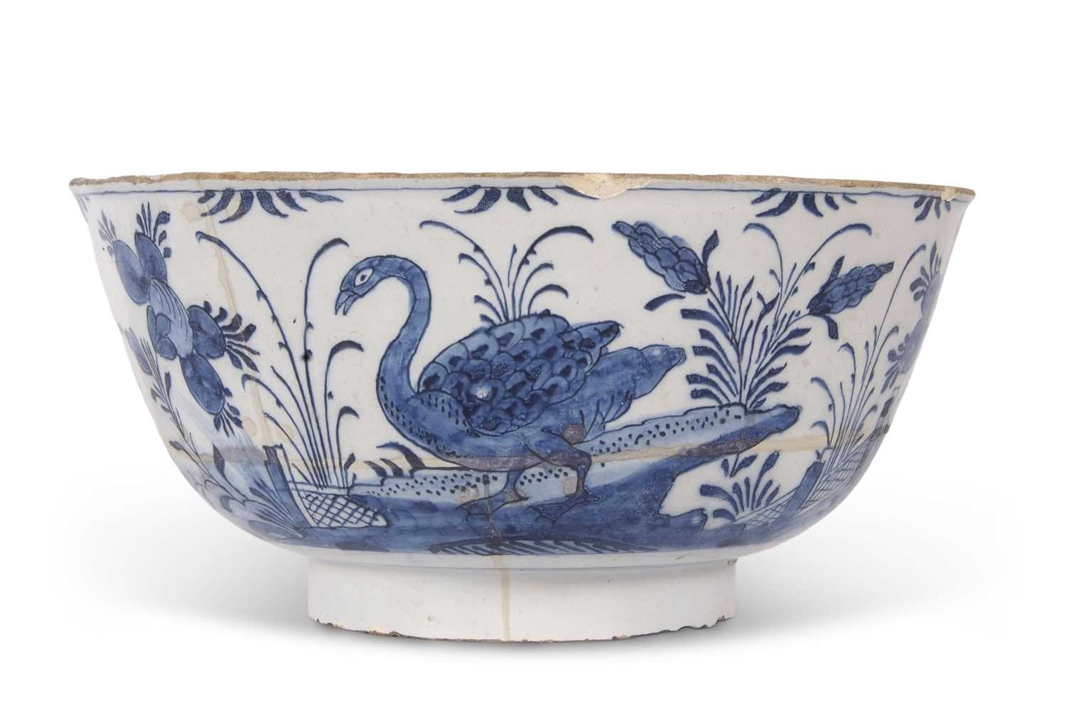 An early 18th Century English Delft punch bowl, circa 1730 with blue and white Chinese porcelain