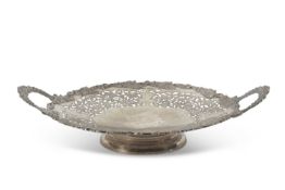 George V large silver twin handled dish of circular form, the edge applied with a grape and vine
