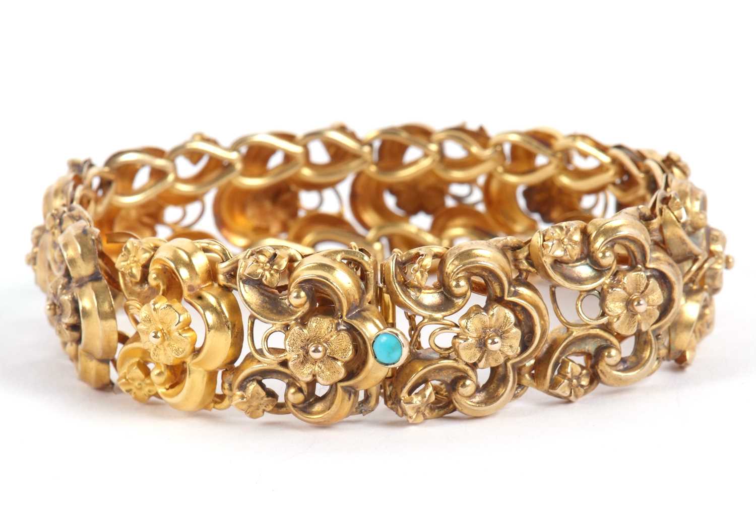 A 19th century bracelet, the articulated repousse links with floral centres, with integrated clasp - Image 2 of 9