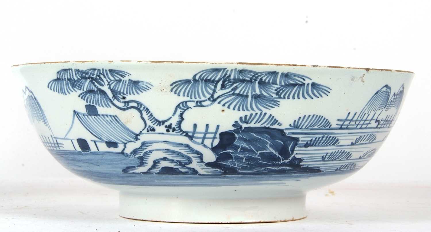 An English Delft punch bowl circa 1760 with blue and white design of house and trees in Chinese - Image 3 of 7