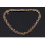 An Archeological revival necklace, the recatangular links with wirework detail to centre and an