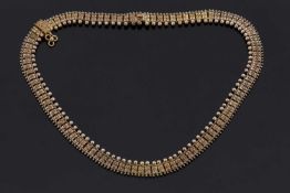 An Archeological revival necklace, the recatangular links with wirework detail to centre and an