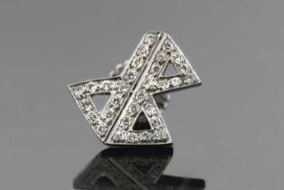 A diamond De Beers brooch, the stylised De Beers 'DB' logo set with single cut diamonds, all set