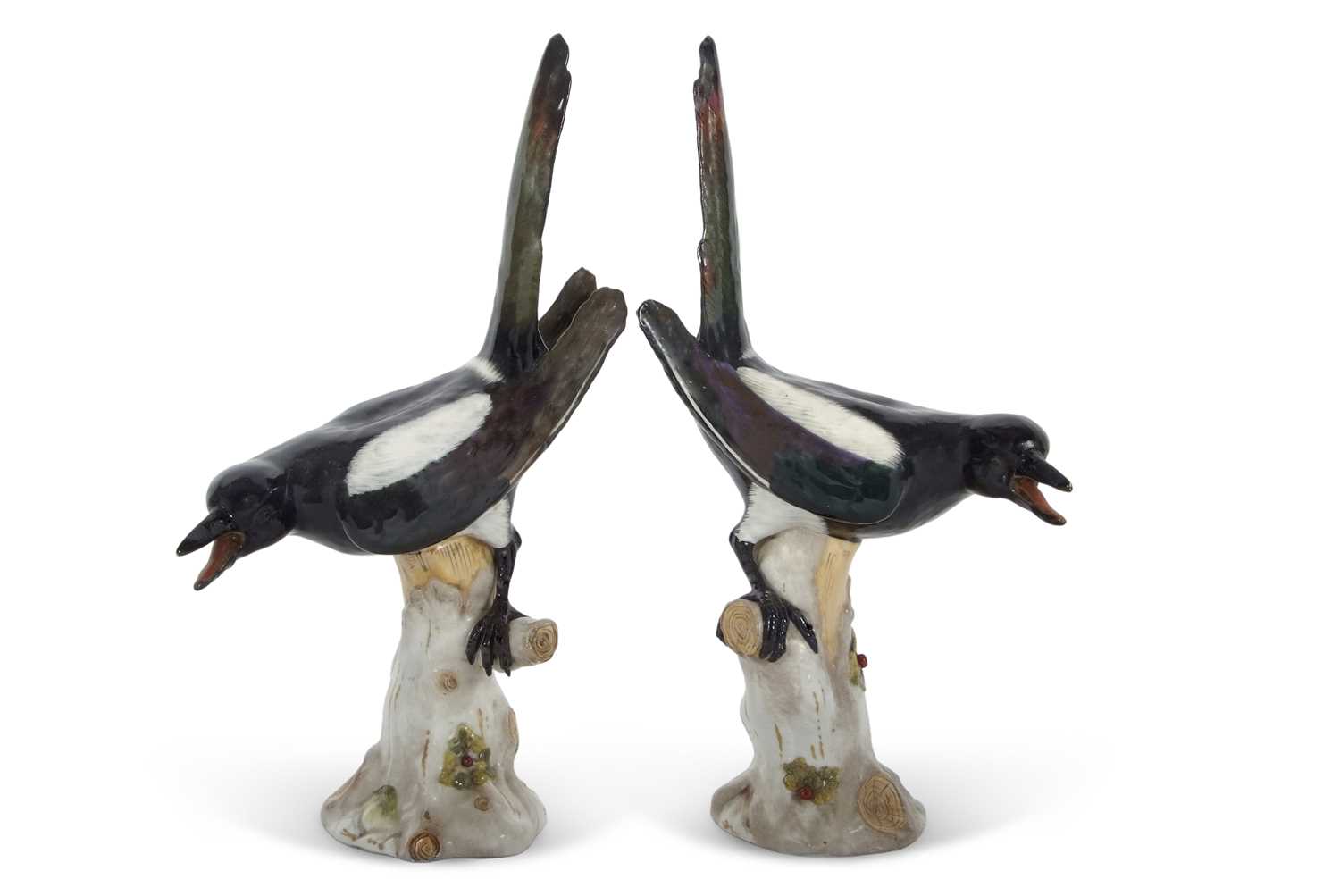 A pair of continental porcelain models of Magpies in Meissen style, factory mark in blue to base