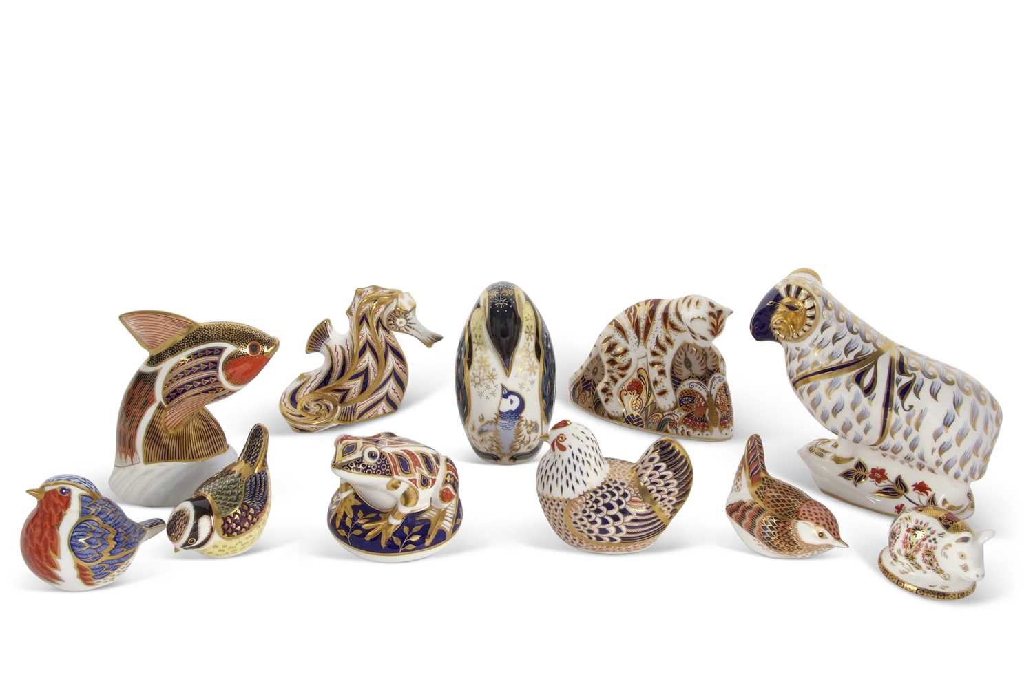 A quantity of Royal Crown Derby paperweights, including Bengal Tiger, a model of a Ram, Penguin,