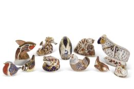 A quantity of Royal Crown Derby paperweights, including Bengal Tiger, a model of a Ram, Penguin,