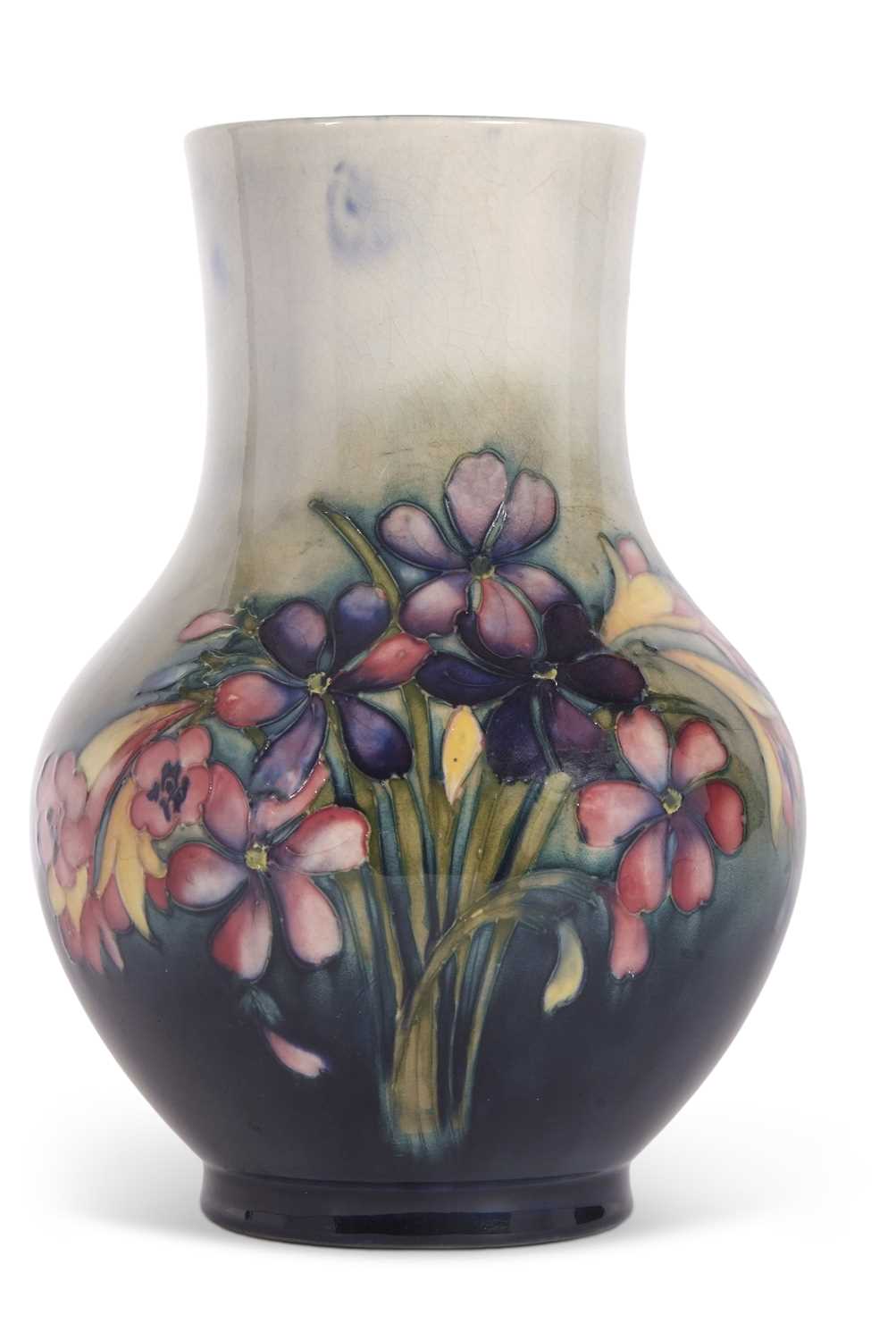 A Mid 20th Century Moorcroft vase of baluster form, the green ground with tubelined decoration of