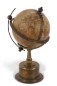 A late 19th Century terrestrial globe library timepiece, The Empire Clock, produced by Smith & Sons,